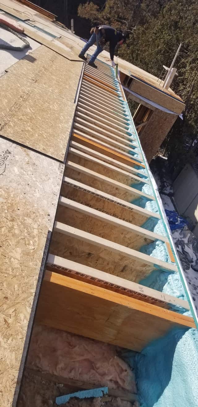 The underside of a floor structure sealed with spray foam