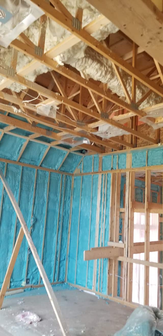 The underside of a floor structure sealed with spray foam