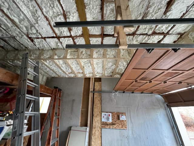 The underside of a floor structure sealed with spray foam